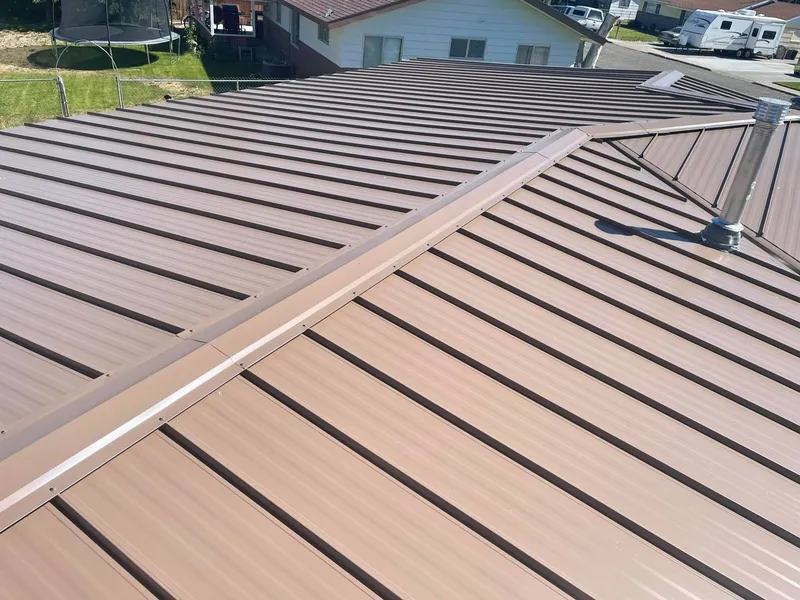 Brown standing-seam metal roof close-up