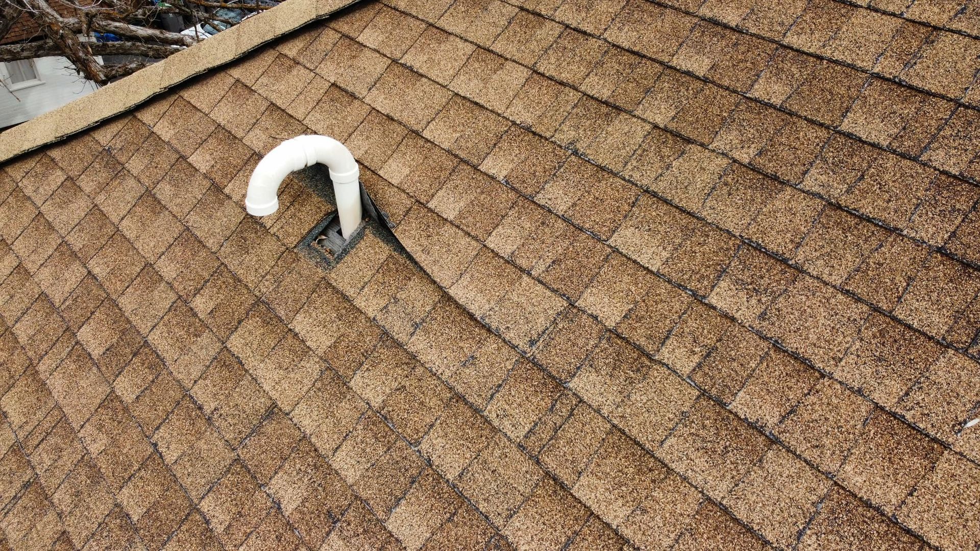 Asphalt roof and pipe flashing detail